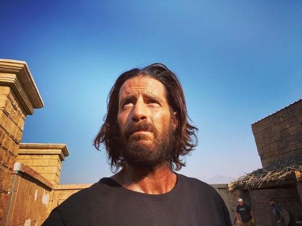 Picture of Jonathan Roumie in a black t-shirt with a nice view of sky